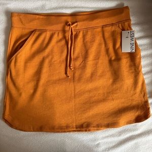 Nine West orange skirt.